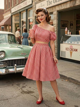 Load image into Gallery viewer, 1950s vintage style red and white gingham two-piece set with a one-shoulder crop top and high-waisted pleated midi swing skirt.