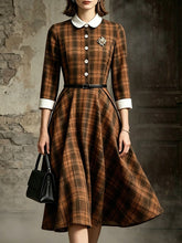 Load image into Gallery viewer, Vintage brown plaid midi dress with white peter pan collar, white sleeve cuffs, and front buttons
