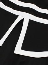 Load image into Gallery viewer, Audrey Hepburn Inspired Black with White Trim Vintage Dress