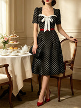 Load image into Gallery viewer, Vintage Black Polka Dot Bow Tie Swing Dress with Short Sleeves
