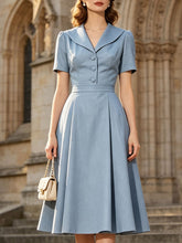 Load image into Gallery viewer, Vintage light blue short sleeve dress with large lapel collar, front matching buttons, and pleated swing skirt