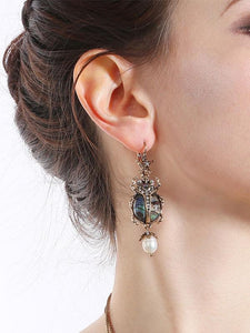 Bettle Juice Earrings With Pearl Star 